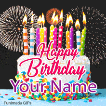 A festive white frosted cake covered in rainbow sprinkles and topped with ten brightly patterned lit candles, set against a dark night sky filled with massive exploding fireworks.