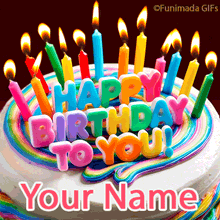 Bright birthday cake with colorful candles and bold rainbow letters forming 'Happy Birthday to You!' on top of a white cake with flowing multicolor icing.